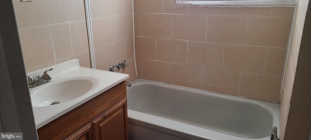 full bathroom featuring vanity and  shower combination