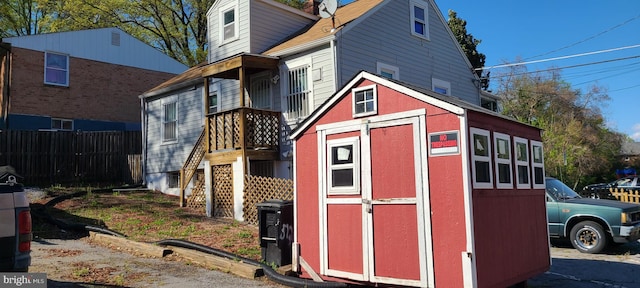 view of shed with fence