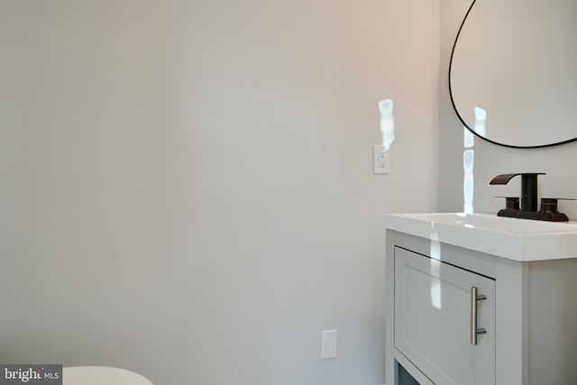 bathroom featuring toilet and vanity