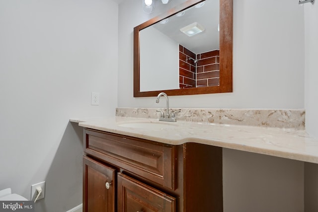 bathroom with toilet and vanity