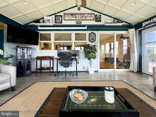 interior space with wood finished floors, a ceiling fan, lofted ceiling, and recessed lighting