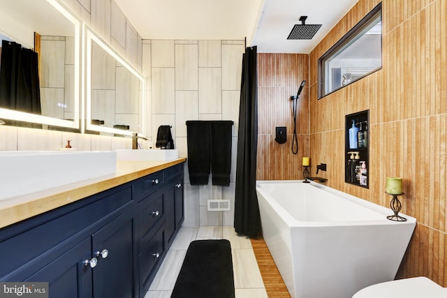 full bath with vanity, toilet, tile patterned floors, tub / shower combination, and visible vents