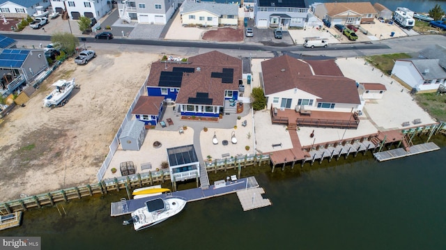 aerial view featuring a water view and a residential view
