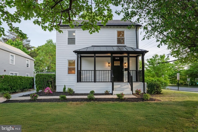 3838 13th St N, Arlington, VA 22201 - traditional style home featuring a standing seam roof, a front lawn, covered porch, and metal roof