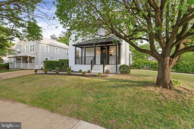 3838 13th St N, Arlington, VA 22201 - view of front of house featuring covered porch and a front lawn