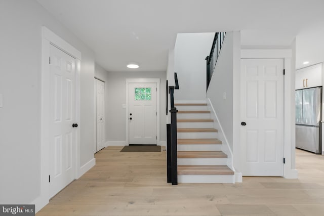3838 13th St N, Arlington, VA 22201 - foyer featuring stairway, baseboards, and light wood-style floors