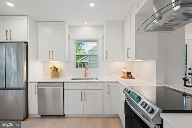 3838 13th St N, Arlington, VA 22201 - kitchen with stainless steel appliances, range hood, a sink, recessed lighting, and white cabinetry