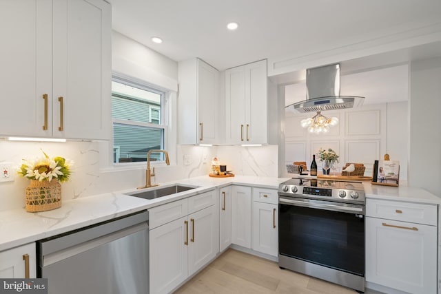 3838 13th St N, Arlington, VA 22201 - kitchen with stainless steel appliances, wall chimney range hood, a sink, tasteful backsplash, and white cabinetry