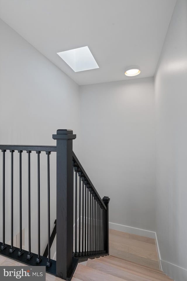 3838 13th St N, Arlington, VA 22201 - stairway with a skylight, wood finished floors, and baseboards