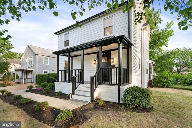 3838 13th St N, Arlington, VA 22201 - traditional style home with a porch and a front lawn