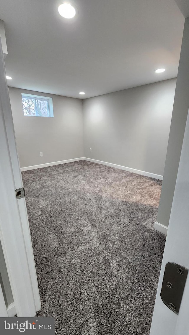 below grade area featuring recessed lighting, carpet floors, and baseboards