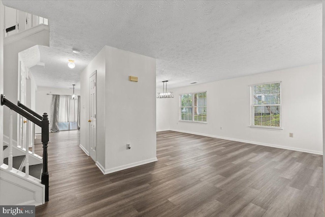 5127 Beaugregory Ct, Waldorf, MD 20603 - interior space featuring baseboards, stairway, a notable chandelier, and dark wood-style flooring