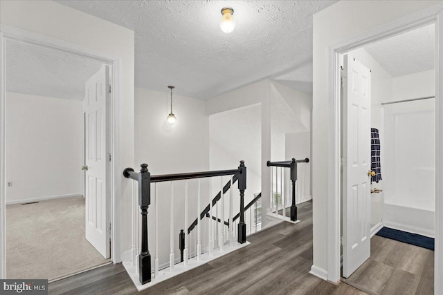 5127 Beaugregory Ct, Waldorf, MD 20603 - additional living space with a textured ceiling, wood finished floors, and baseboards