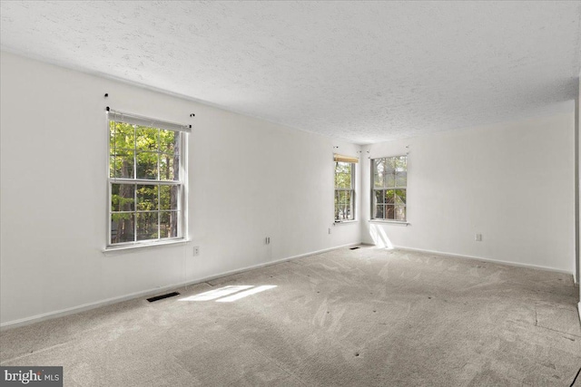 5127 Beaugregory Ct, Waldorf, MD 20603 - carpeted empty room featuring baseboards, visible vents, and a textured ceiling