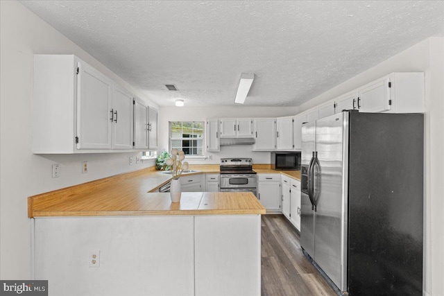 5127 Beaugregory Ct, Waldorf, MD 20603 - kitchen featuring stainless steel appliances, a textured ceiling, dark wood-style flooring, and a peninsula