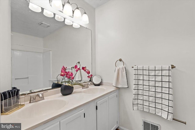 5127 Beaugregory Ct, Waldorf, MD 20603 - full bathroom with visible vents, a shower, double vanity, and a sink