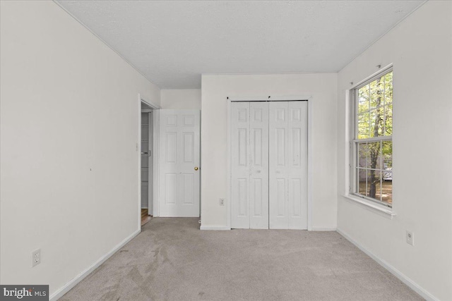 5127 Beaugregory Ct, Waldorf, MD 20603 - unfurnished bedroom featuring a closet, carpet floors, and baseboards