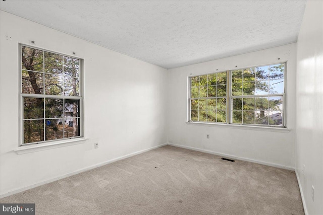 5127 Beaugregory Ct, Waldorf, MD 20603 - spare room with carpet flooring, a textured ceiling, visible vents, and baseboards