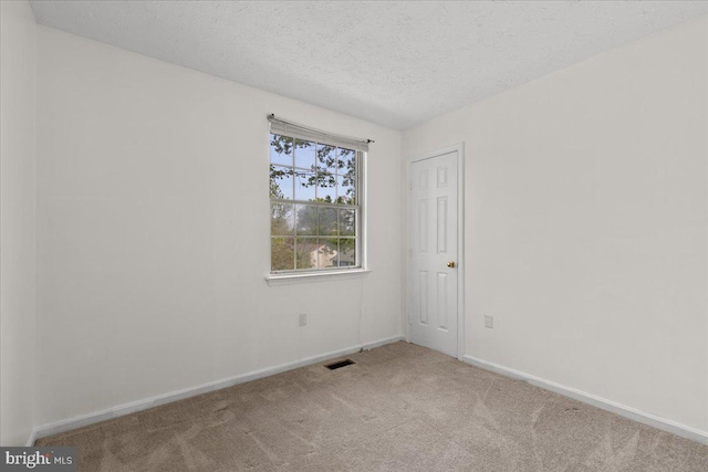 5127 Beaugregory Ct, Waldorf, MD 20603 - carpeted spare room featuring a textured ceiling, visible vents, and baseboards