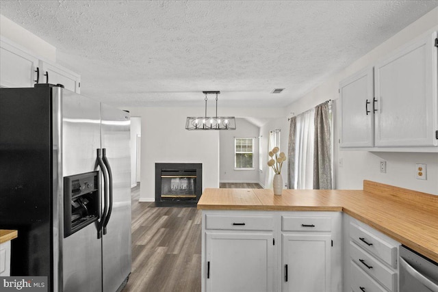 5127 Beaugregory Ct, Waldorf, MD 20603 - kitchen with dark wood finished floors, white cabinets, a peninsula, and appliances with stainless steel finishes