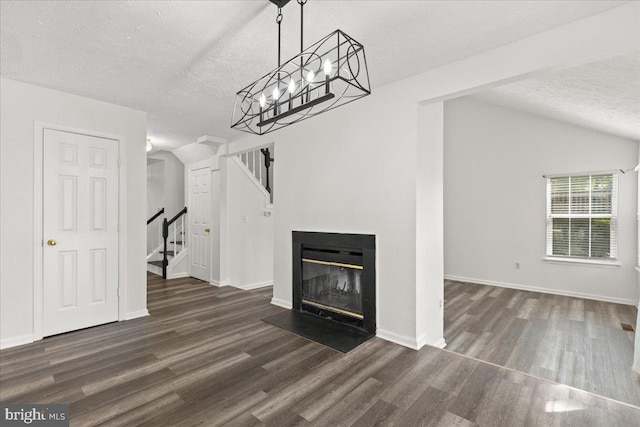 5127 Beaugregory Ct, Waldorf, MD 20603 - unfurnished living room featuring lofted ceiling, a textured ceiling, baseboards, wood finished floors, and stairs
