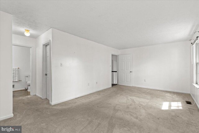 5127 Beaugregory Ct, Waldorf, MD 20603 - carpeted spare room with baseboards, visible vents, and a textured ceiling