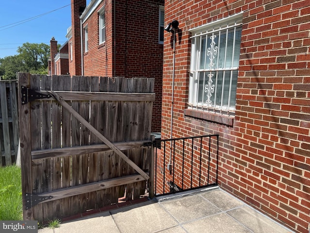 view of gate featuring fence