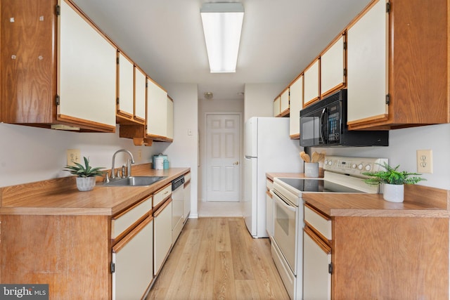 9552 Cannoneer Ct Unit 204, Manassas, VA 20110 - kitchen featuring white appliances, a sink, light wood finished floors, and light countertops
