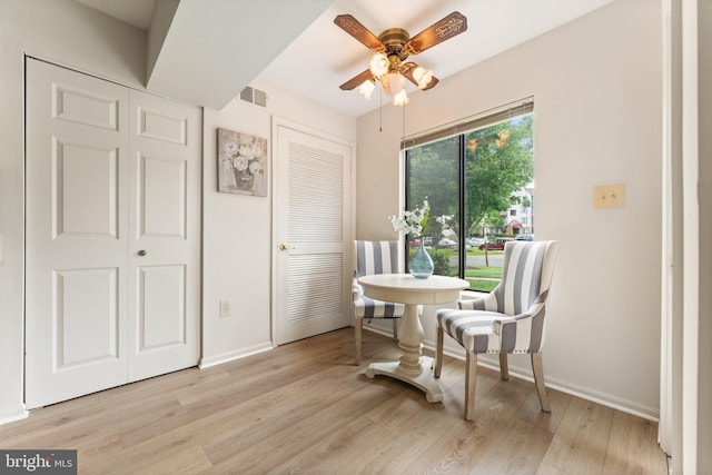 9552 Cannoneer Ct Unit 204, Manassas, VA 20110 - sitting room featuring a ceiling fan, light wood-type flooring, and baseboards