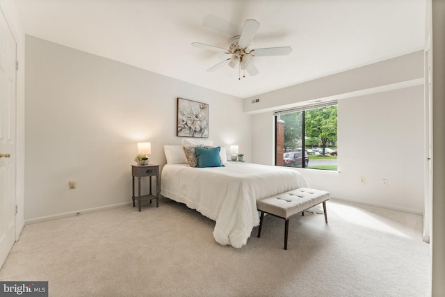 9552 Cannoneer Ct Unit 204, Manassas, VA 20110 - bedroom with light colored carpet, baseboards, and ceiling fan