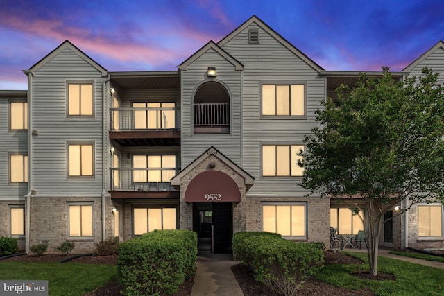 9552 Cannoneer Ct Unit 204, Manassas, VA 20110 - townhome / multi-family property with a balcony and brick siding