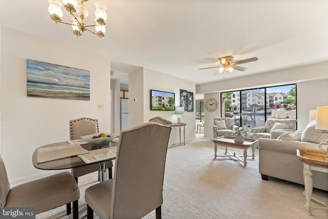 9552 Cannoneer Ct Unit 204, Manassas, VA 20110 - dining area with light colored carpet, a chandelier, and a ceiling fan