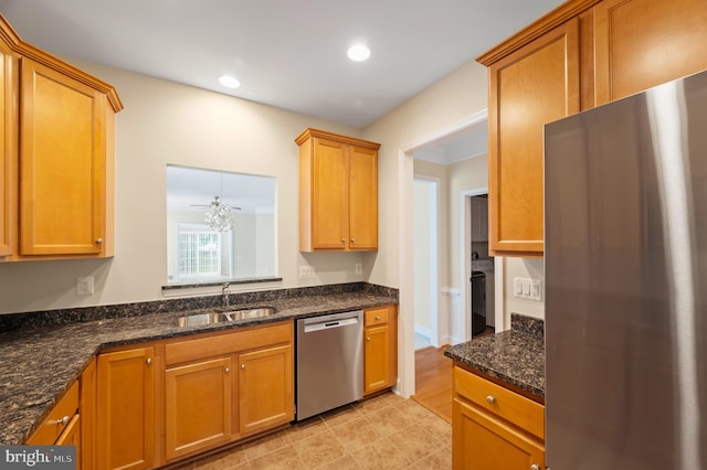 20449 Rosses Point Ct, Ashburn, VA 20147 - kitchen with appliances with stainless steel finishes, dark stone countertops, recessed lighting, and brown cabinetry