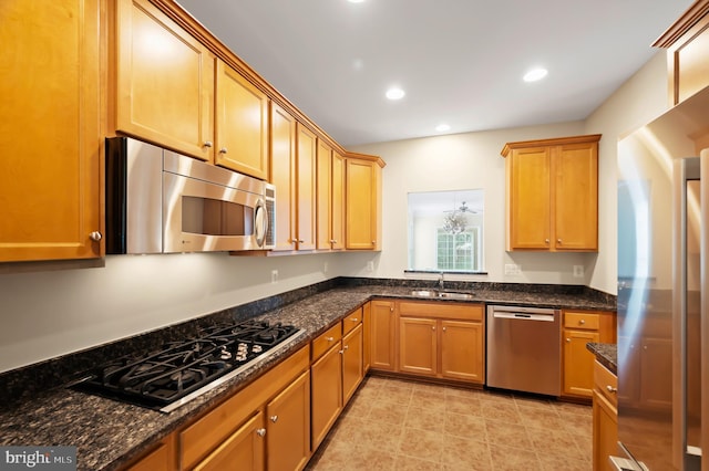 20449 Rosses Point Ct, Ashburn, VA 20147 - kitchen with stainless steel appliances, dark stone countertops, recessed lighting, and light tile patterned flooring