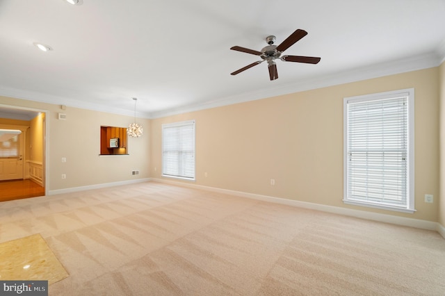 20449 Rosses Point Ct, Ashburn, VA 20147 - unfurnished room featuring light colored carpet, ornamental molding, a ceiling fan, and a chandelier