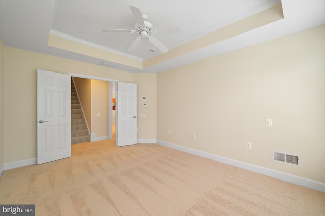 20449 Rosses Point Ct, Ashburn, VA 20147 - unfurnished bedroom featuring a tray ceiling, carpet, ornamental molding, and a ceiling fan