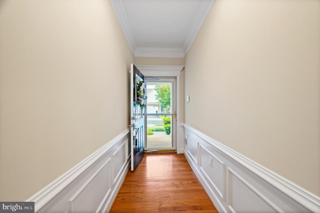 20449 Rosses Point Ct, Ashburn, VA 20147 - entryway with ornamental molding, a wainscoted wall, a decorative wall, and light wood-style flooring