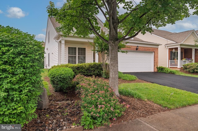 20449 Rosses Point Ct, Ashburn, VA 20147 - obstructed view of property with driveway, a garage, and brick siding
