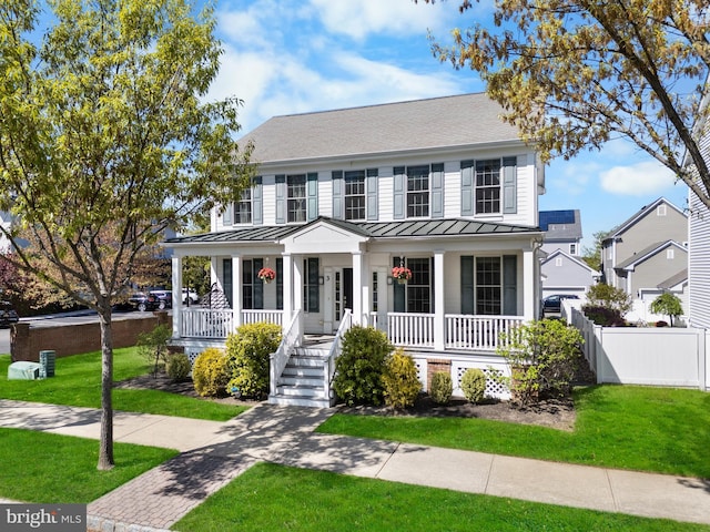 3 Union St, Robbinsville, NJ 08691 - view of front facade featuring fence, a front lawn, a porch, a standing seam roof, and metal roof