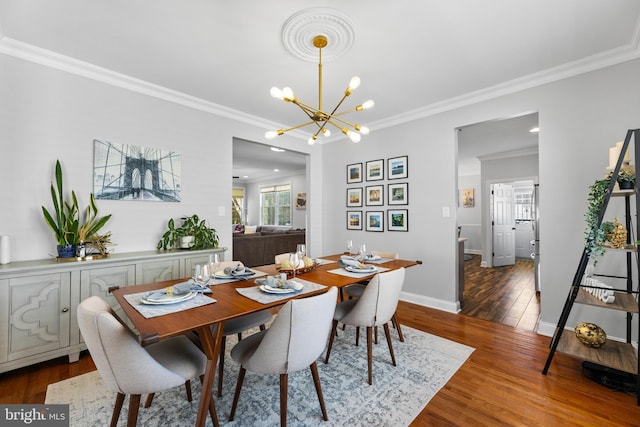 3 Union St, Robbinsville, NJ 08691 - dining area with crown molding, baseboards, an inviting chandelier, and wood finished floors