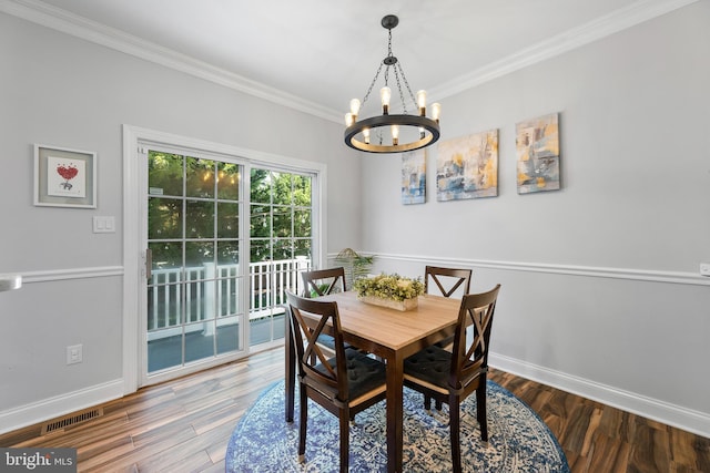 3 Union St, Robbinsville, NJ 08691 - dining area with crown molding, visible vents, wood finished floors, baseboards, and a chandelier