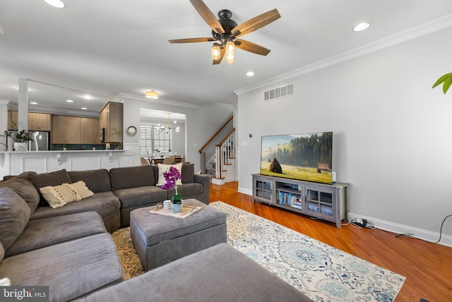 3 Union St, Robbinsville, NJ 08691 - living area featuring ceiling fan with notable chandelier, stairs, baseboards, visible vents, and ornamental molding