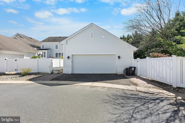 3 Union St, Robbinsville, NJ 08691 - view of home's exterior featuring fence, driveway, and a garage