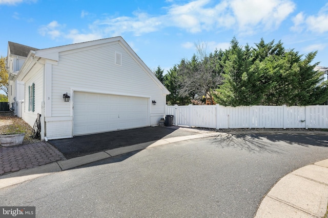 3 Union St, Robbinsville, NJ 08691 - view of side of property with central AC, fence, driveway, and a garage