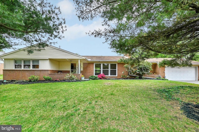single story home with a front lawn, brick siding, an attached garage, and concrete driveway