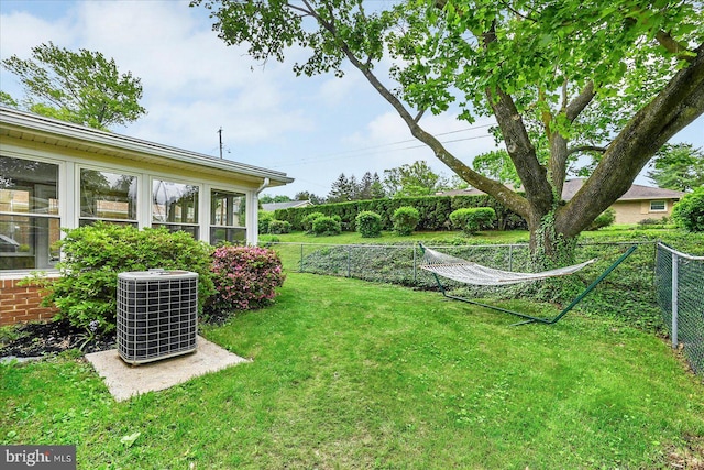 view of yard featuring a fenced backyard and cooling unit