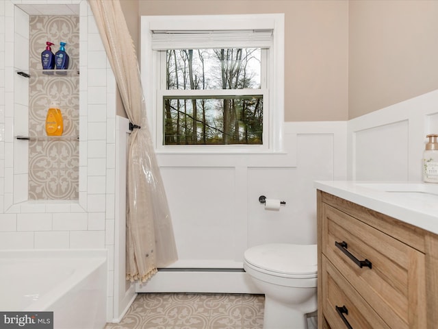 full bathroom with a baseboard radiator, toilet, tile patterned floors, a decorative wall, and vanity