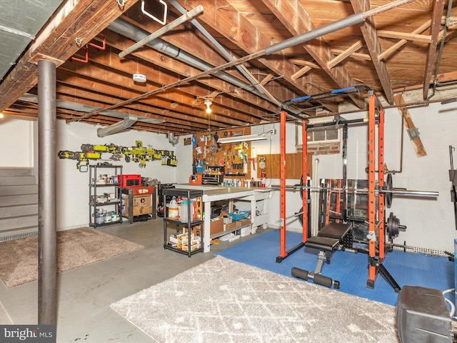 unfinished below grade area with a workshop area