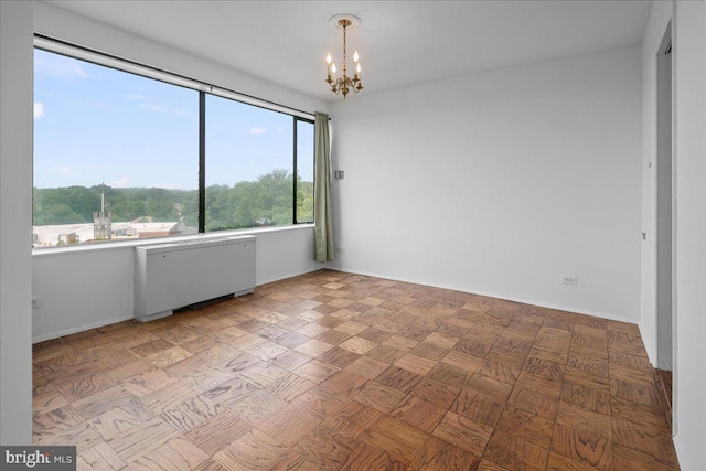 4501 Arlington Blvd Unit 709, Arlington, VA 22203 - unfurnished room with a chandelier and baseboards