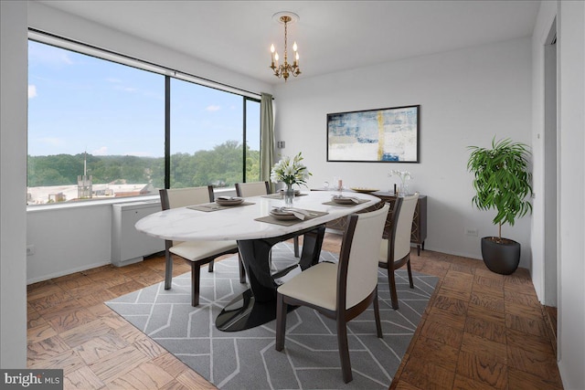 4501 Arlington Blvd Unit 709, Arlington, VA 22203 - dining area featuring a chandelier and baseboards